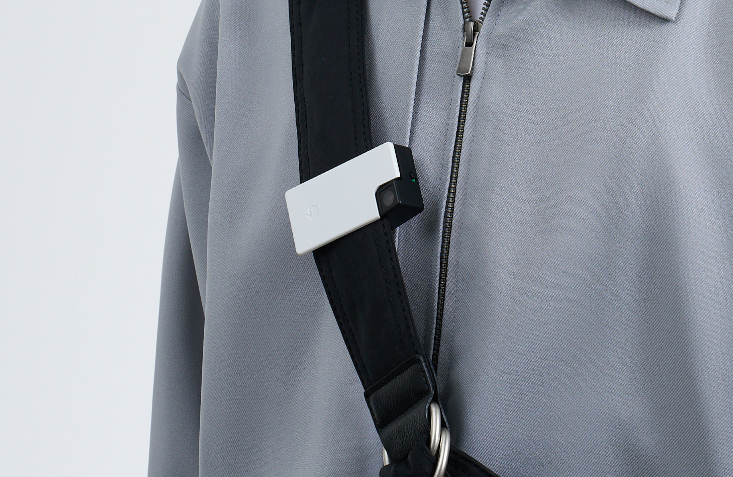Person clipping Saveclip to a bag